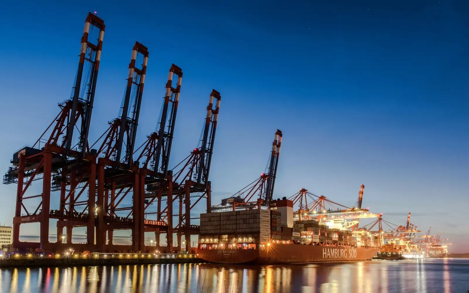Container cranes at the quay at dusk